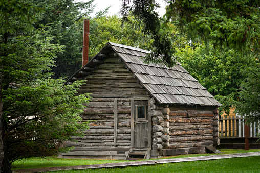 Old log cabin in Skagway, Alaska, rainy day you can see the rain coming down if you enlarge the file