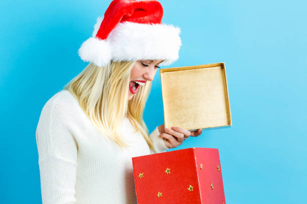 istock Happy young woman with Christmas present box 1064745974