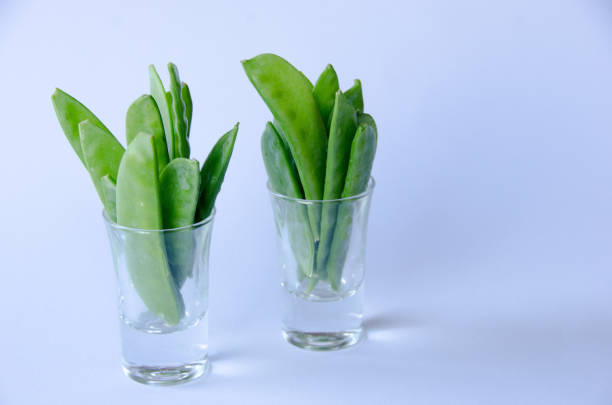 istock Snow peas in a little glass 1064747630