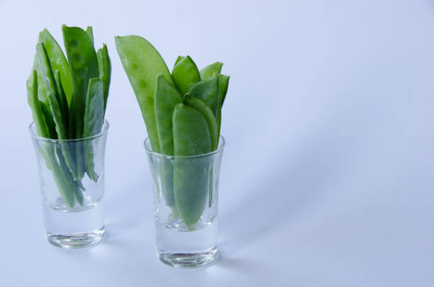 istock Snow peas in a little glass 1064747644