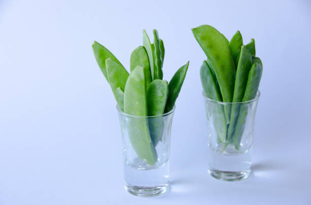 istock Snow peas in a little glass 1064748154