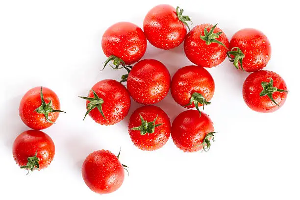 Photo of wet red cherry tomatoes isolated on white