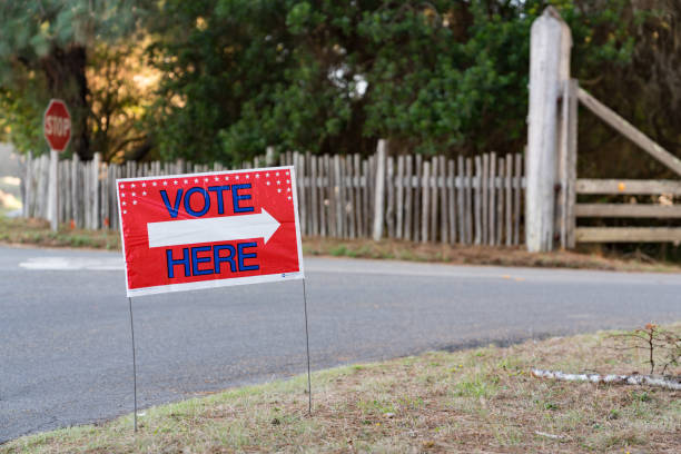 Voting Polling Place sign in front road and gate