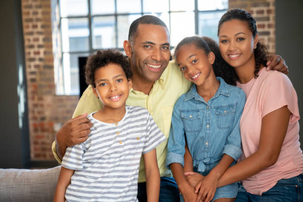 istock Happy black family at home 1064761898