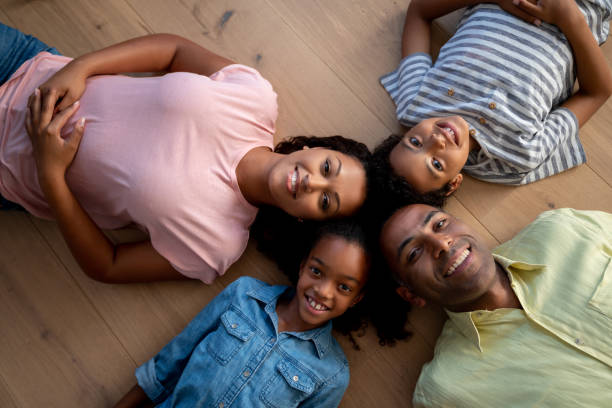 istock Happy black family at home 1064761904