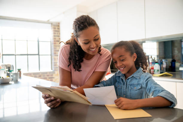 Mother and daughter checking the mail at home