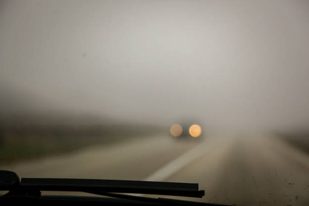 istock Fog on road - Car in fogy 1064763782