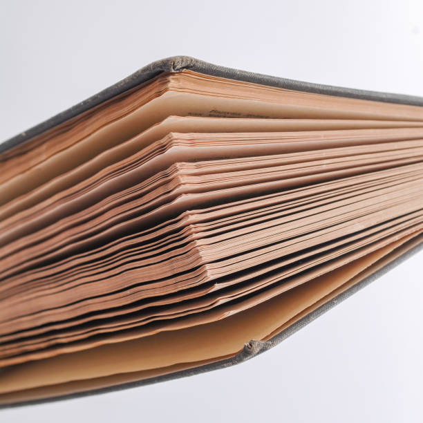 istock Old book. Vintage book with brown aged pages. 1064766914
