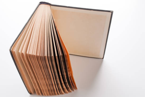 istock Old book. Vintage book with brown aged pages. 1064766916