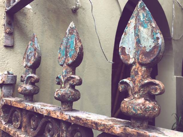 nola Old wrought iron fleur de lis fence. new orleans fleur de lis stock pictures, royalty-free photos & images