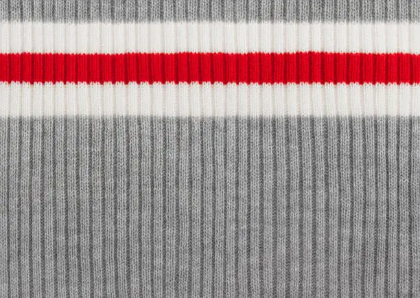 Photo of Gray, White and Red Striped Knit Wool Background