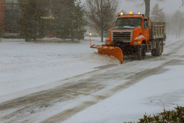 istock Clearing the road from snow street during snow blizzard 1064785552