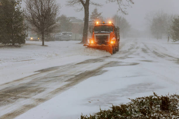 istock Snow clearing. Tractor clears the way after heavy snowfall. 1064785560
