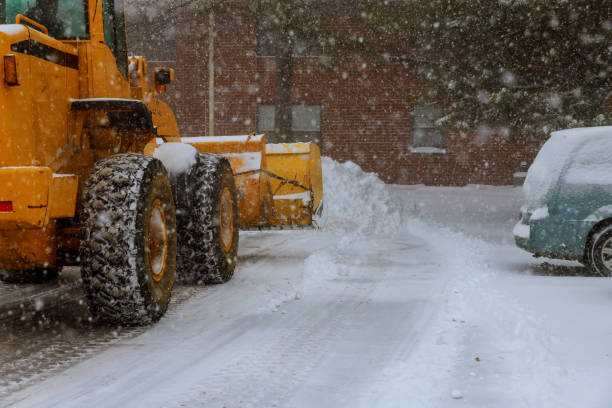 istock The bulldozer cleans the road after a blizzard 1064785570