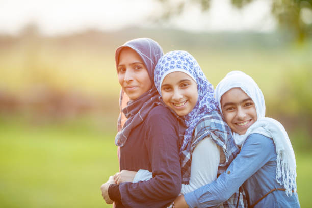 istock Muslim mother and daughters outside 1064787818