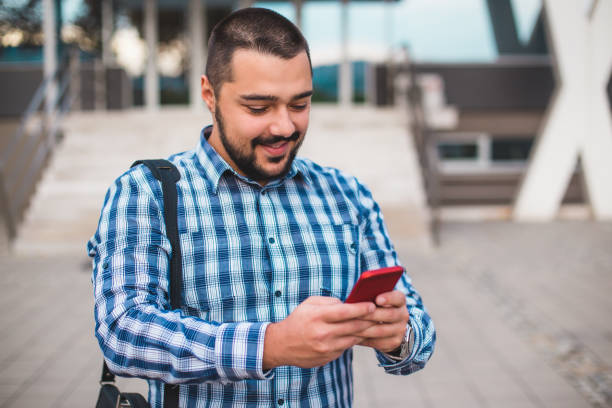 istock Young businessman using cell phone 1064790262