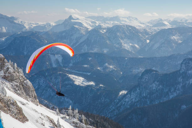 istock Paraglider flying over the Austrian Apls on the sunny day 1064793712