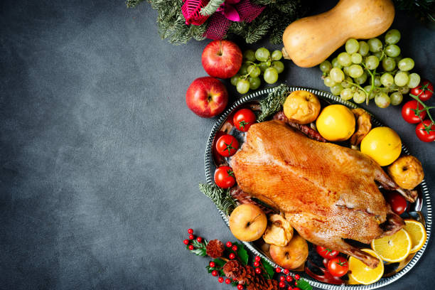 istock Thanksgiving roasted whole goose on rustic table 1064795398