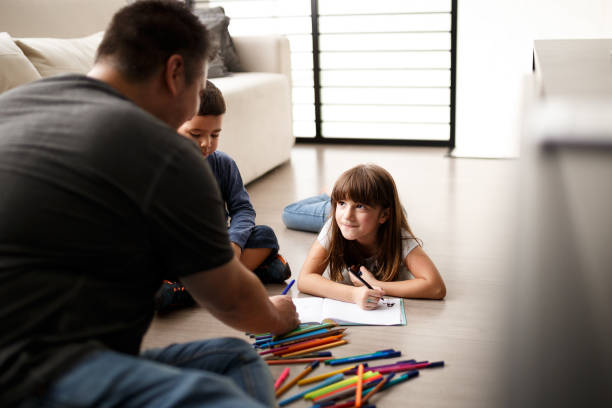 istock Father playing with his son and daughter 1064799512