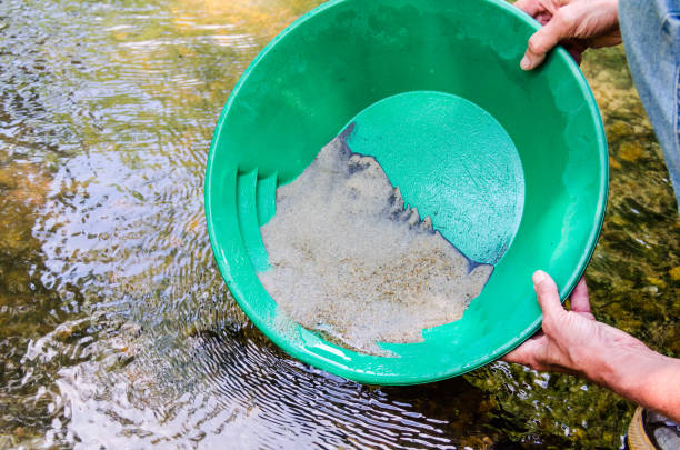 istock Gold panning in mineral rich stream 1064801414