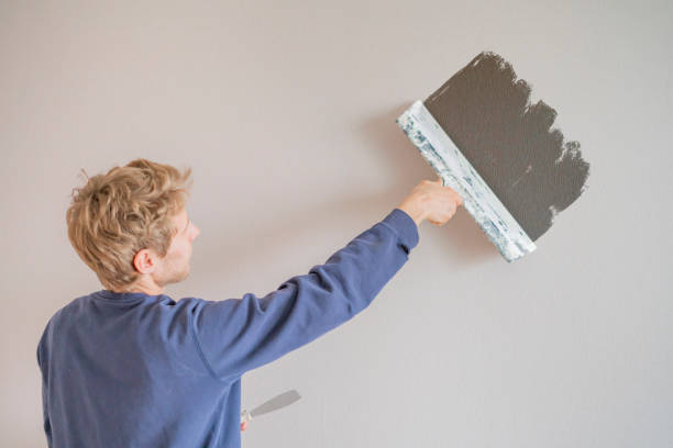 istock putty knife making the wall repair f 1064803814