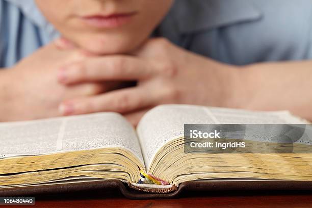 Reading The Bible Stock Photo - Download Image Now - 20-24 Years, 25-29 Years, 30-34 Years