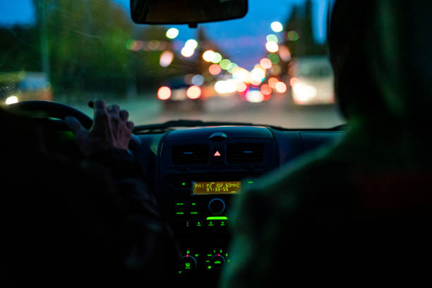 taxi driver in the car in the city traffic f taxi driver in the car in the city traffic taxi driver photos stock pictures, royalty-free photos & images