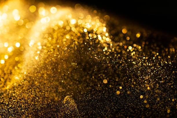 istock glitter lights grunge background, gold glitter defocused abstract Twinkly Lights Background. 1064813732