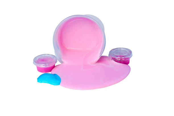 istock slime spill out from plastic box isolated on white background. 1064816362