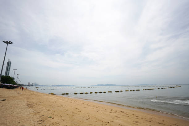 Pattaya, Thailand - December 26, 2023. Boats on turquoise water. North Pattaya beach in Thailand seaside. Pattaya, Thailand. . High quality photo