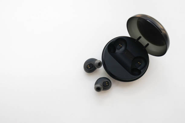 istock isolated portable wireless earphone with trendy case 1064831114