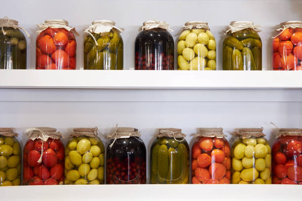 istock preserved jars of vegetables on shelf 1064834162