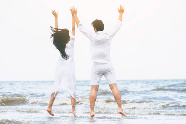 istock Couple going honeymoon on tropical beach in summer 1064836992