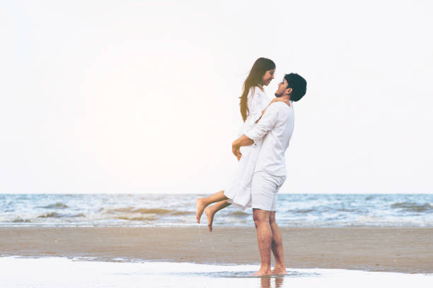 istock Couple going honeymoon on tropical beach in summer 1064836994