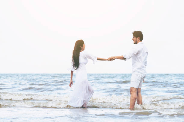 istock Couple going honeymoon on tropical beach in summer 1064837010
