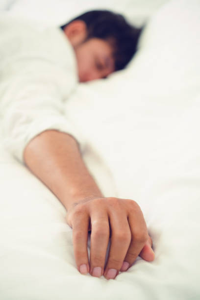 istock Young man sleep in bed in the bedroom. 1064838708
