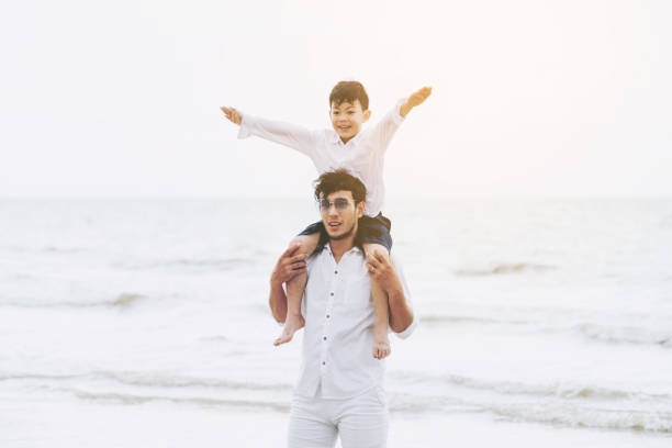 istock Happy father carrying his son on the neck. 1064838722