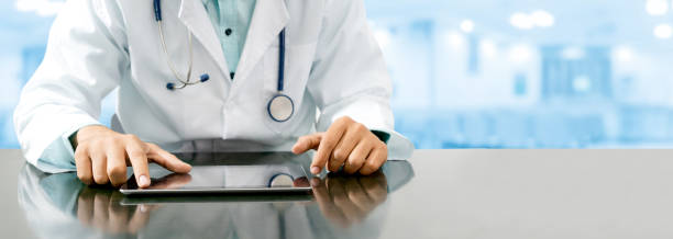 istock Doctor with tablet computer at hospital office. 1064841356