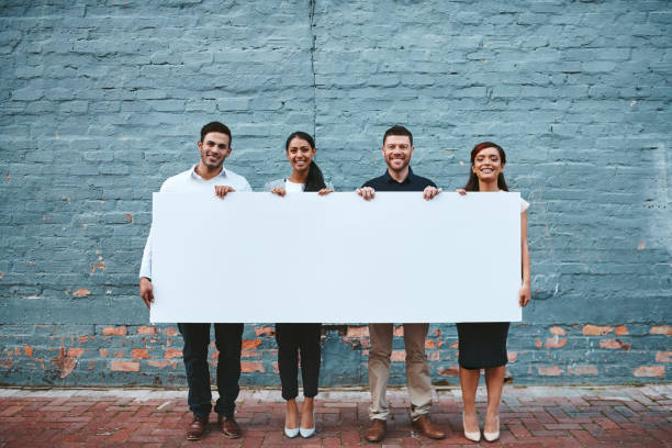 we really wanted to share this message with you - placard women holding standing imagens e fotografias de stock