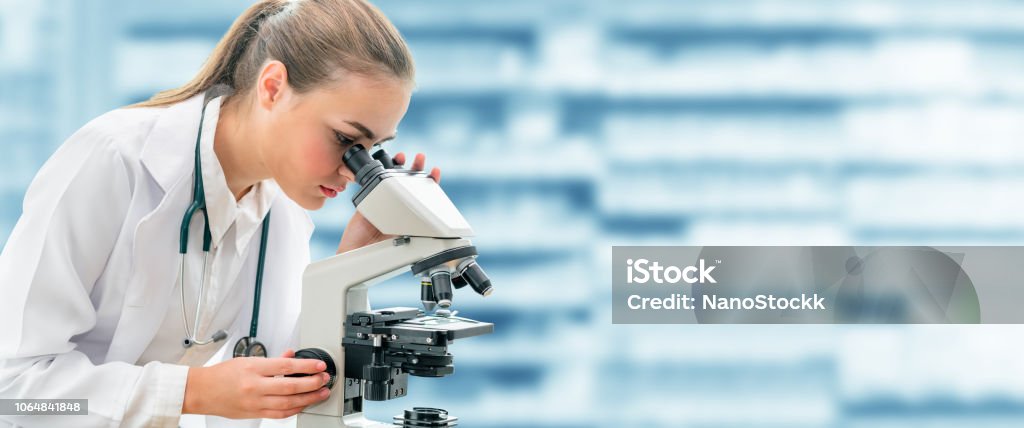 Scientist researcher uses microscope in laboratory Scientist researcher using microscope in laboratory. Medical healthcare technology and pharmaceutical research and development concept. Microscope Stock Photo