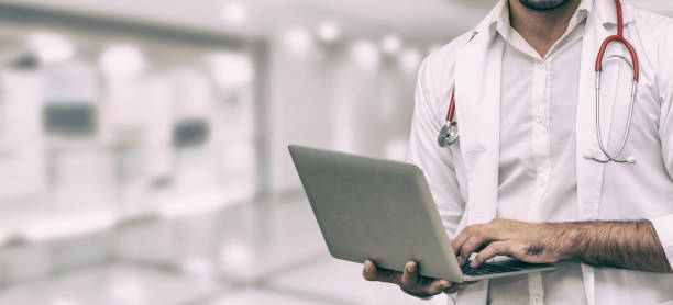 istock Doctor using laptop computer at the hospital. 1064841964
