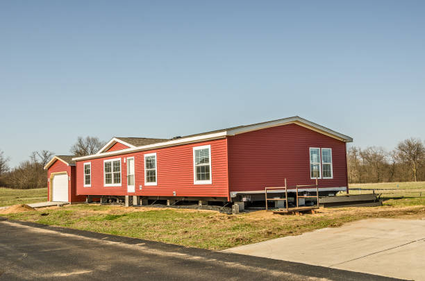 Red Vinyl Siding on New Manufactured Home stock photo