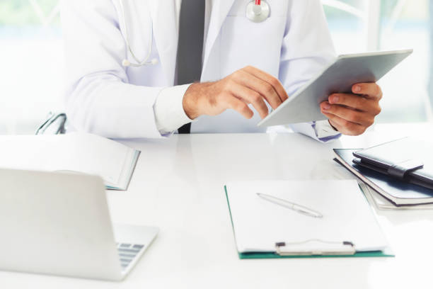 istock Doctor working on tablet computer in the hospital.Doctor working on tablet computer in the hospital. 1064852854