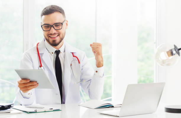 istock Doctor working on tablet computer in the hospital.Doctor working on tablet computer in the hospital. 1064852872