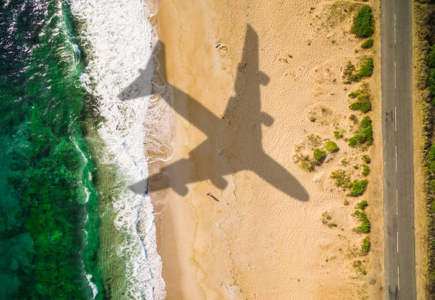 Aerial view airplane shadow on the beach