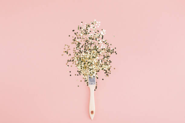 istock Surreal Paint brush drawing golden stars confetti 1064872594
