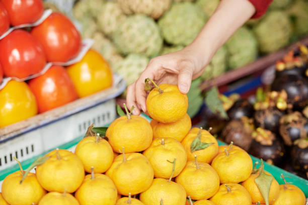 istock Customer buying tangerine 1064873542