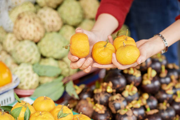 istock Buying ripe tangerines 1064873548