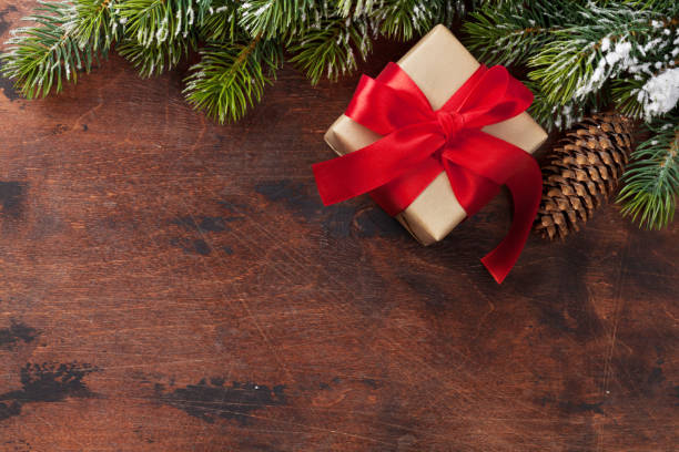 istock Christmas gift box and fir tree branch 1064877106