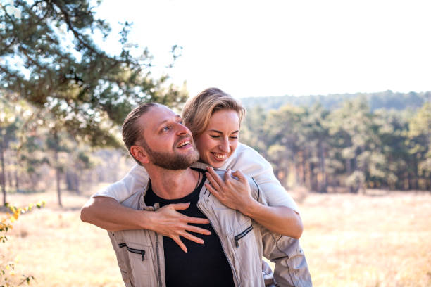istock Couple in love hugging in the forest. 1064878098